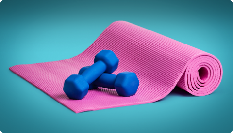 A purple yoga mat with two small blue dumbbell weights on top.